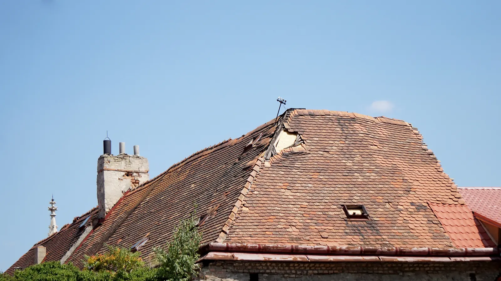 Old clay tile roof with a dormer