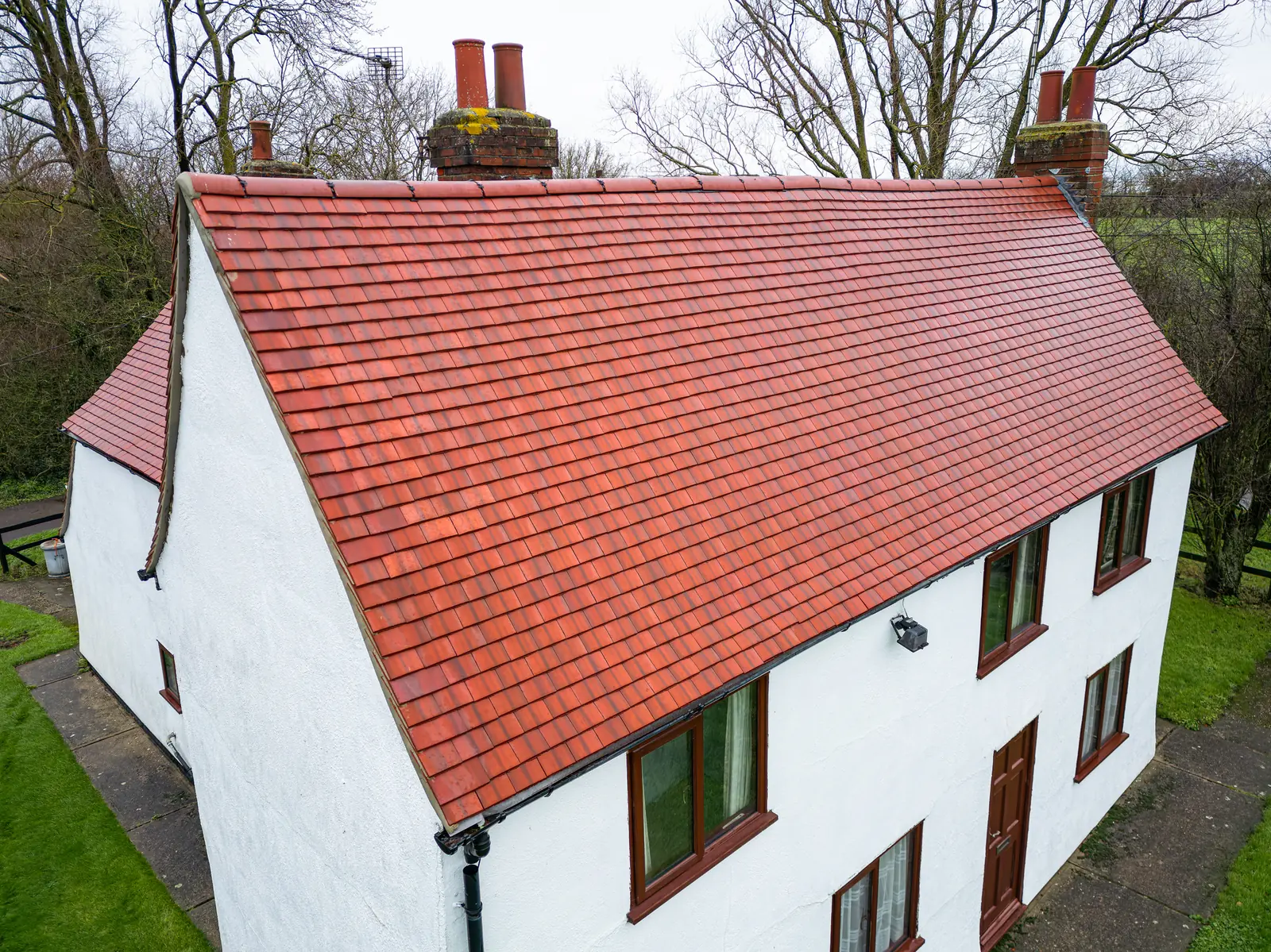 Red tiled roof on a white house