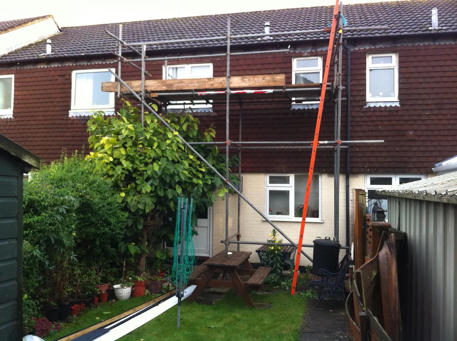 Terraced houses under scaffolding for roof work