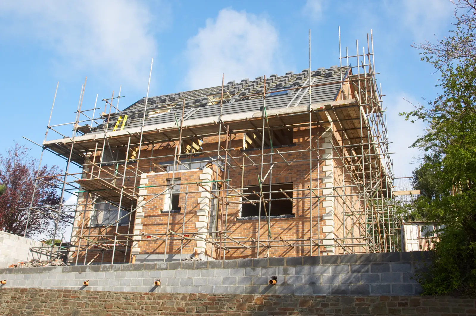New build house under scaffolding