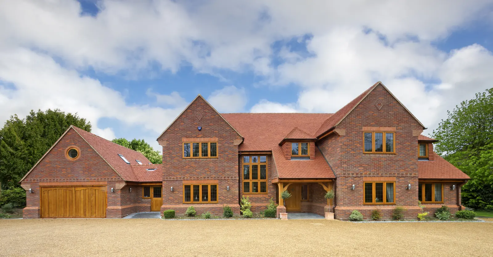 Gravel driveway in front of a detached house