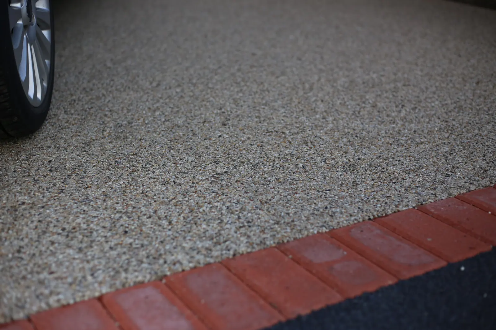 Resin bound driveway with a brick border