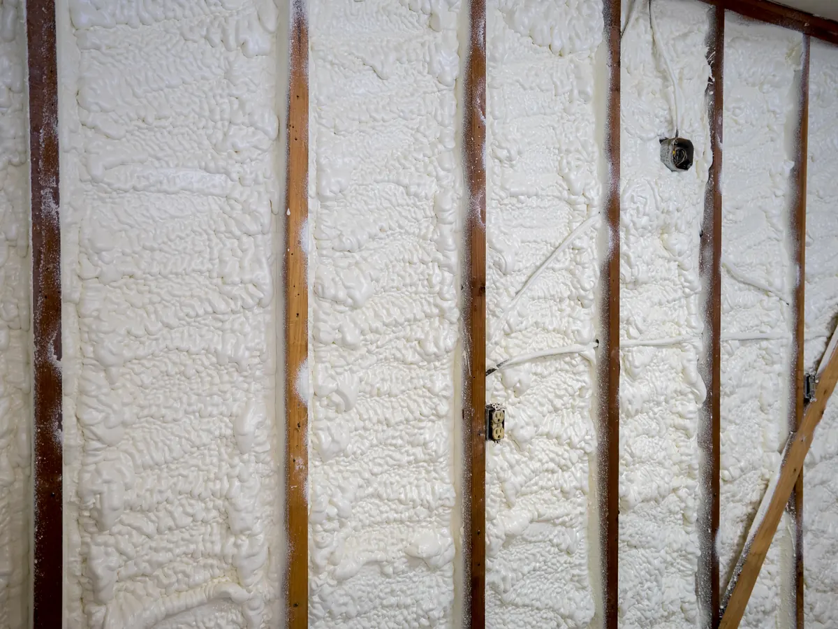 Close view of spray foam removal work in progress